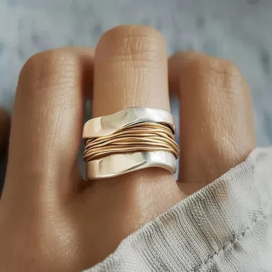 Silver ring with golden threads