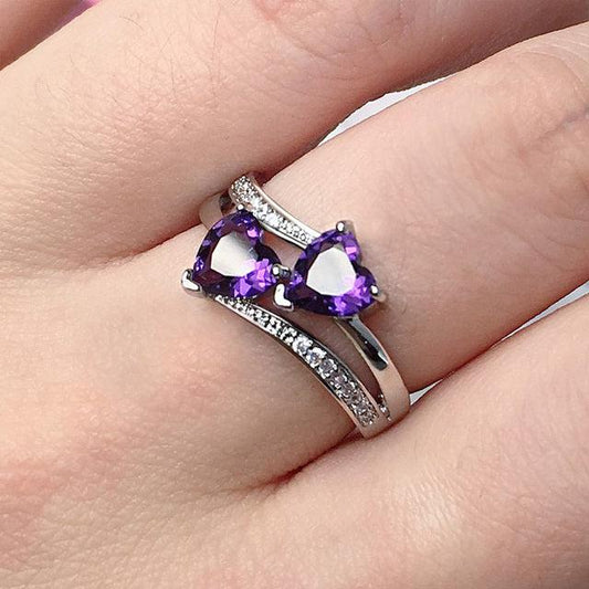 Stylish ring with purple crystal in silver